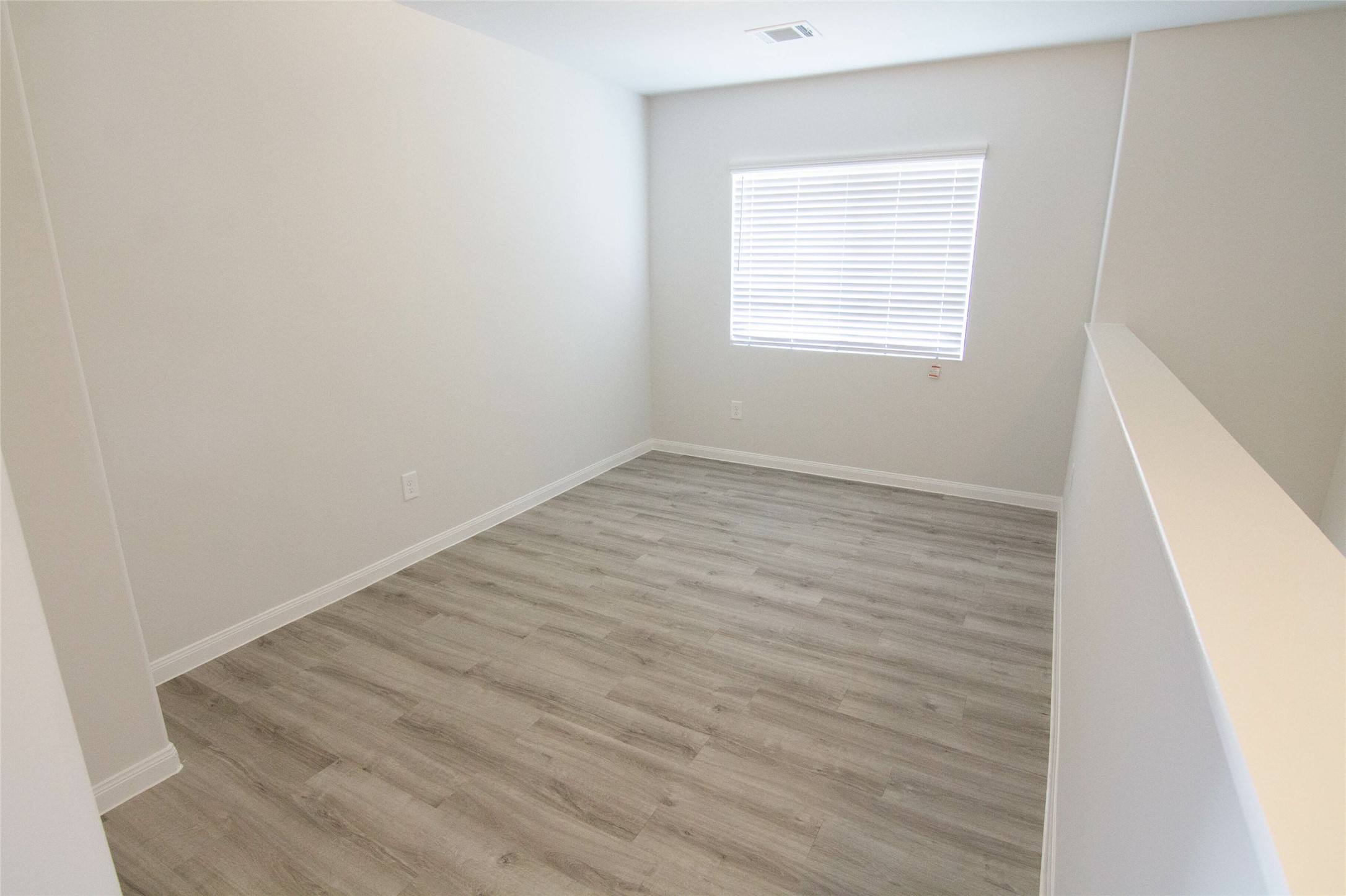 18611 Bell Ravine Drive Katy, TX 77449 - Photo 8 of 12 an empty room with a window