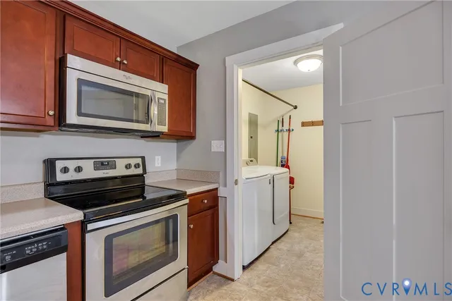 a kitchen with a stove microwave and sink