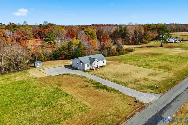 a view of a swimming pool with a yard and mountain view
