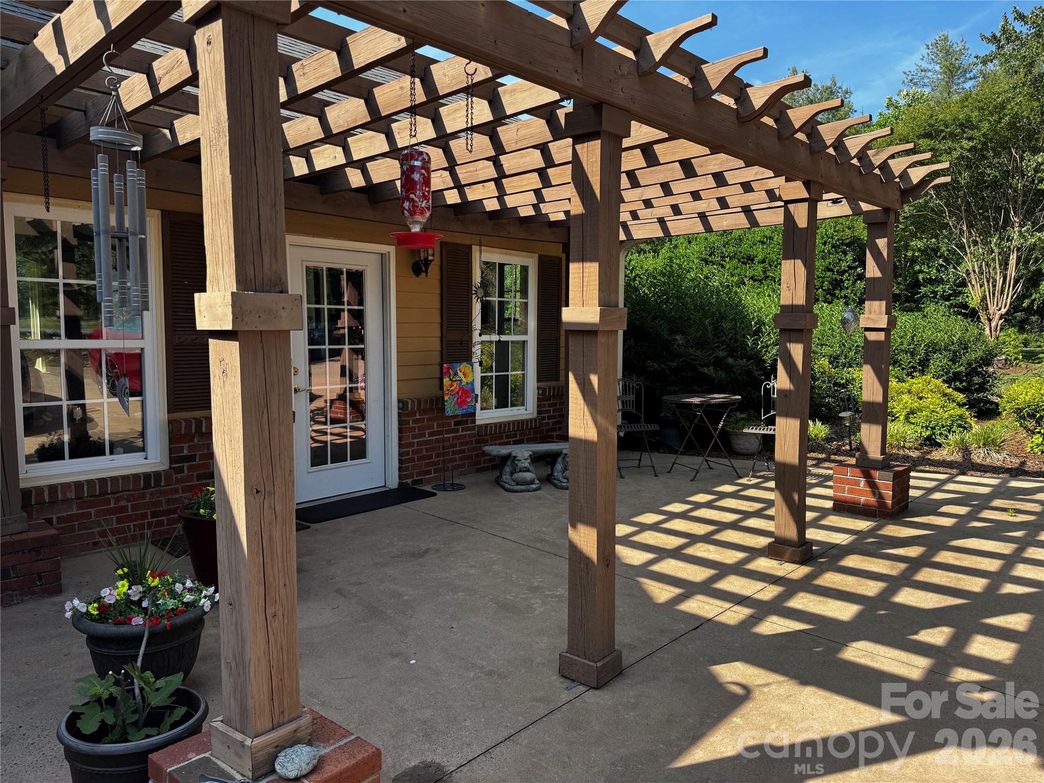 204 Old Stage Coach Road Lawndale, NC 28090 - Photo 2 of 30 a view of a chairs and table in a patio