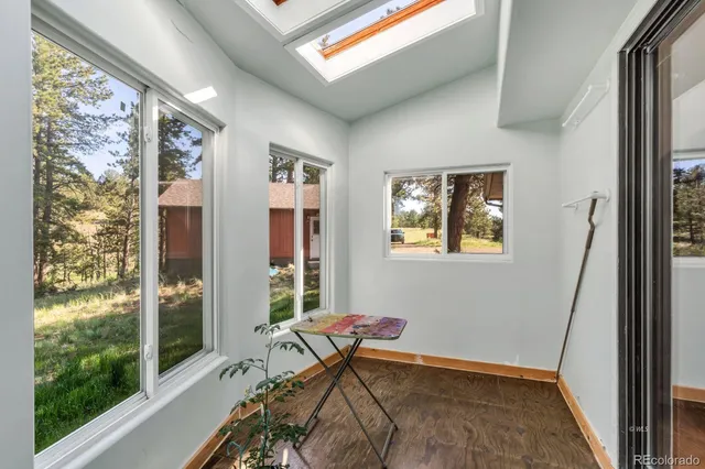 a bedroom with a bed and a view of kitchen