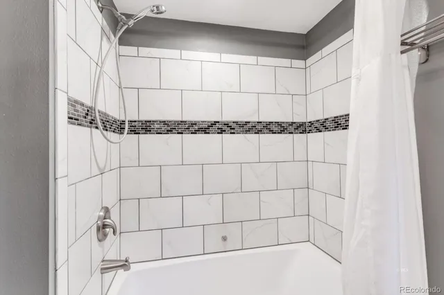 a view of a livingroom with furniture and a flat screen tv