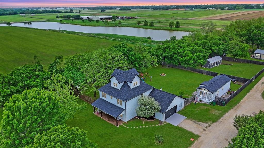 11061 Foutch Road Pilot Point, TX 76258 - Photo 2 of 37 Aerial perspective reveals the thoughtful layout of the property, including distinct yard areas, CASITA, garden space, and room to expand or enjoy outdoor living.