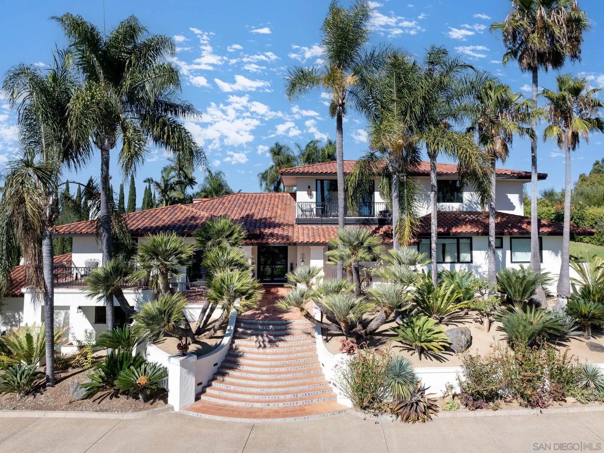 18245 Paseo Victoria Rancho Santa Fe, CA 92067 - Photo 39 of 40 a front view of a house with yard and green space