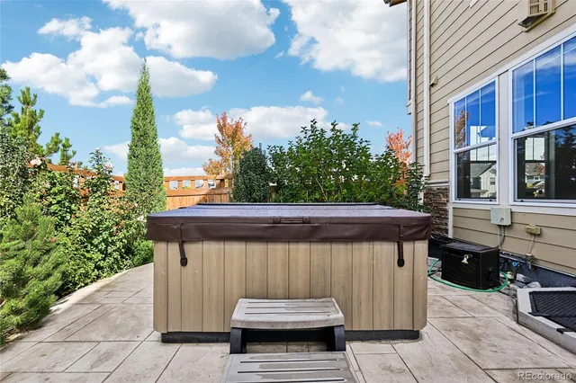 a backyard of a house with yard and outdoor seating