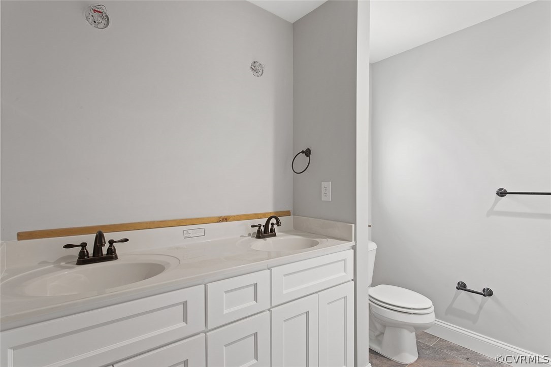 116 Diggstown Road Bumpass, VA 23024 - Photo 14 of 20 a bathroom with a sink and a toilet