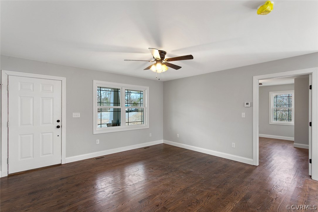 116 Diggstown Road Bumpass, VA 23024 - Photo 3 of 20 a view of an empty room with wooden floor and a window