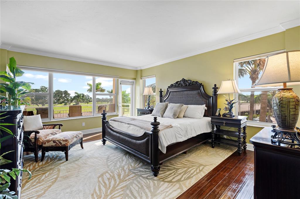 603 Longboat Club Road, Unit 304N Longboat Key, FL 34228 - Photo 13 of 43 a bedroom with a bed and large window