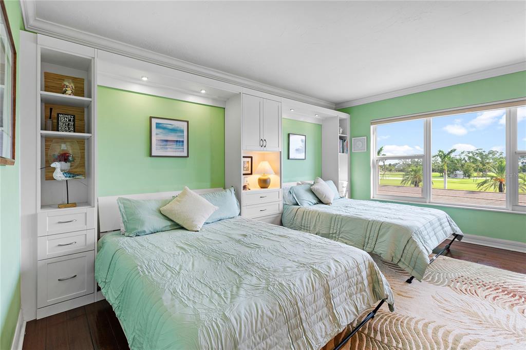 603 Longboat Club Road, Unit 304N Longboat Key, FL 34228 - Photo 17 of 43 a bedroom with a bed and a large window