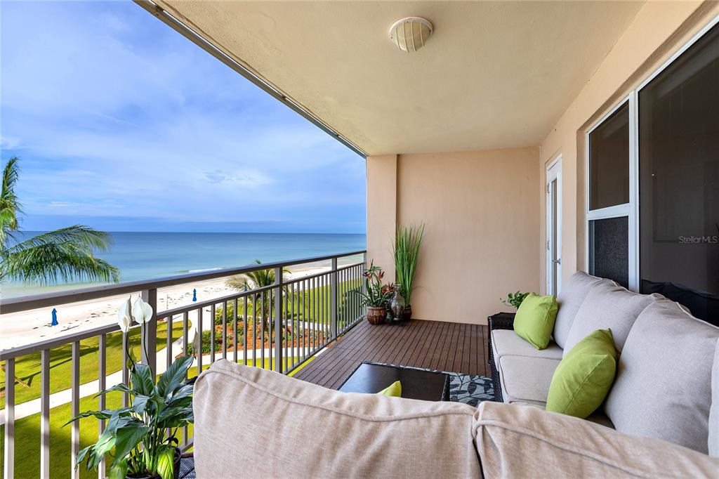 603 Longboat Club Road, Unit 304N Longboat Key, FL 34228 - Photo 2 of 43 a living room with furniture and a potted plant