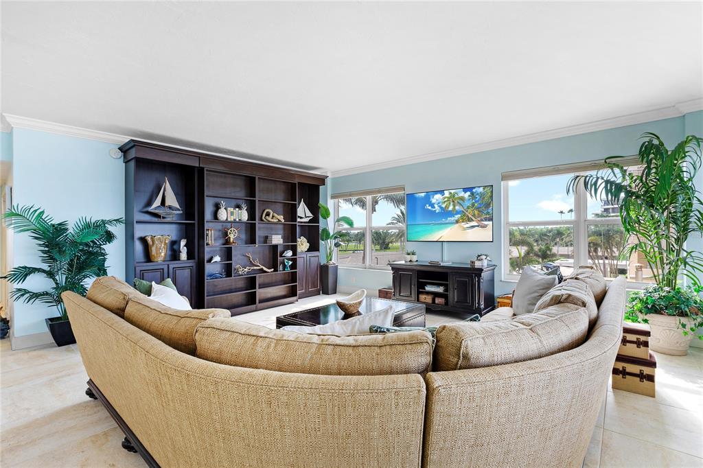 603 Longboat Club Road, Unit 304N Longboat Key, FL 34228 - Photo 6 of 43 a living room with fireplace furniture and a fireplace