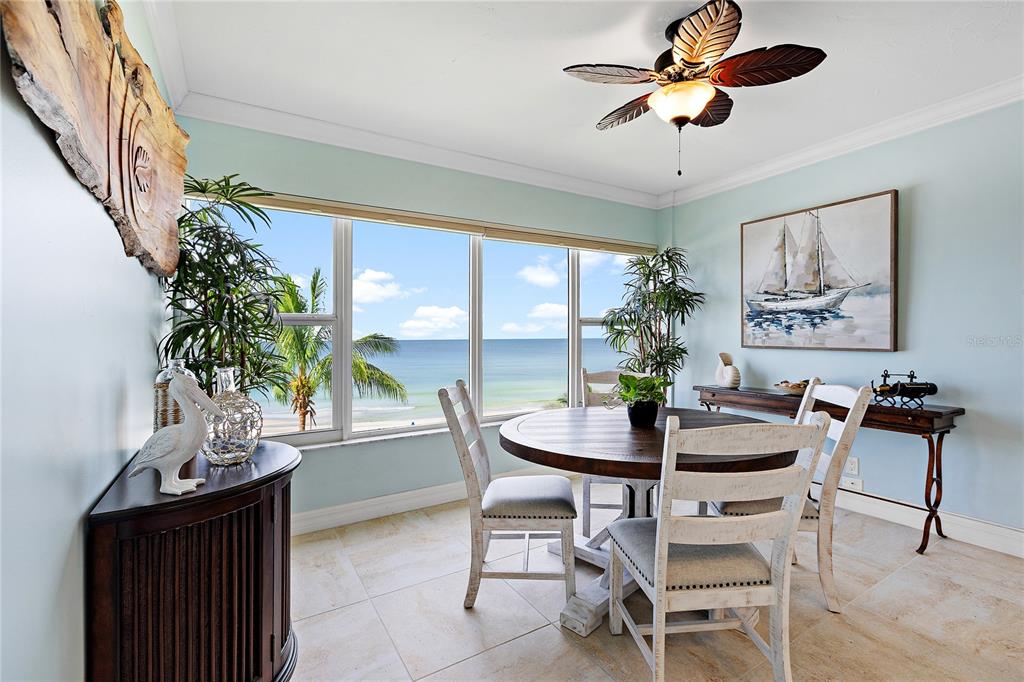 603 Longboat Club Road, Unit 304N Longboat Key, FL 34228 - Photo 7 of 43 a dining room with furniture and window