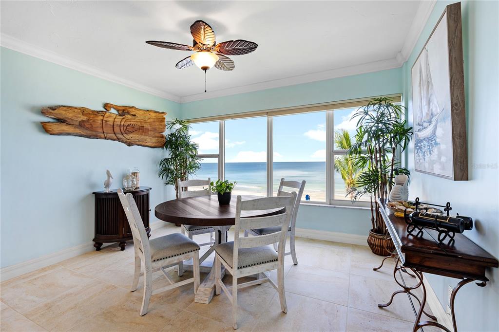 603 Longboat Club Road, Unit 304N Longboat Key, FL 34228 - Photo 8 of 43 a view of a dining room with furniture window and outside view