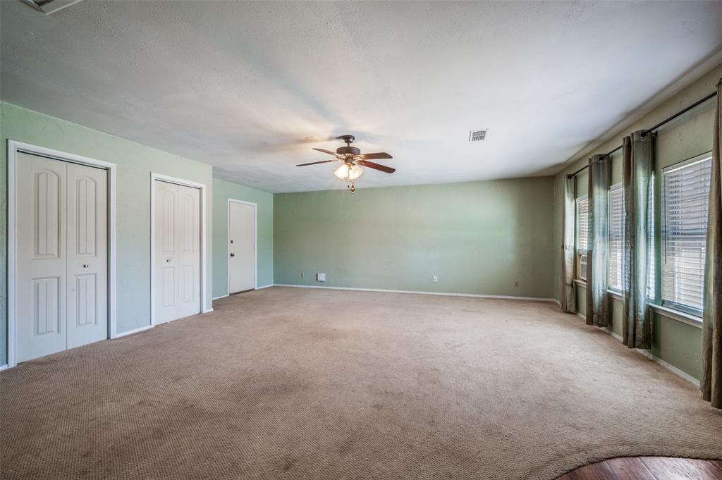 508 South Pedigo Street Pilot Point, TX 76258 - Photo 15 of 25 a view of a livingroom with a ceiling fan and window