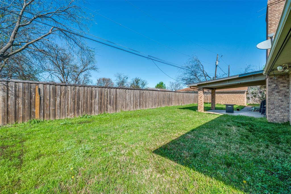 508 South Pedigo Street Pilot Point, TX 76258 - Photo 23 of 25 a view of a backyard with wooden fence