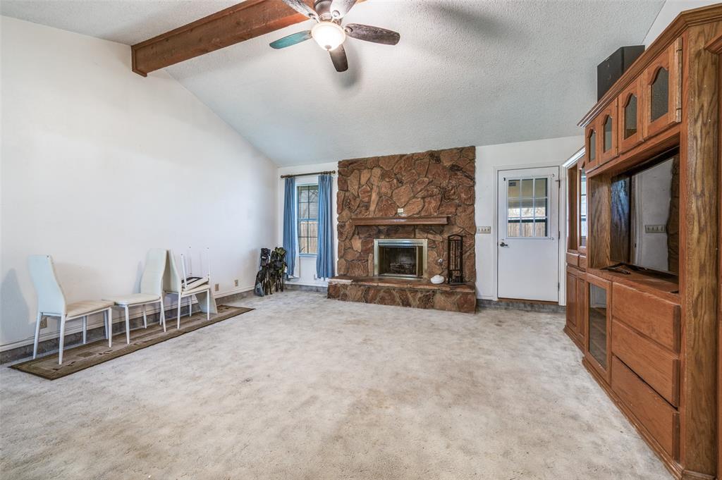 508 South Pedigo Street Pilot Point, TX 76258 - Photo 6 of 25 a view of a livingroom with furniture and a fireplace