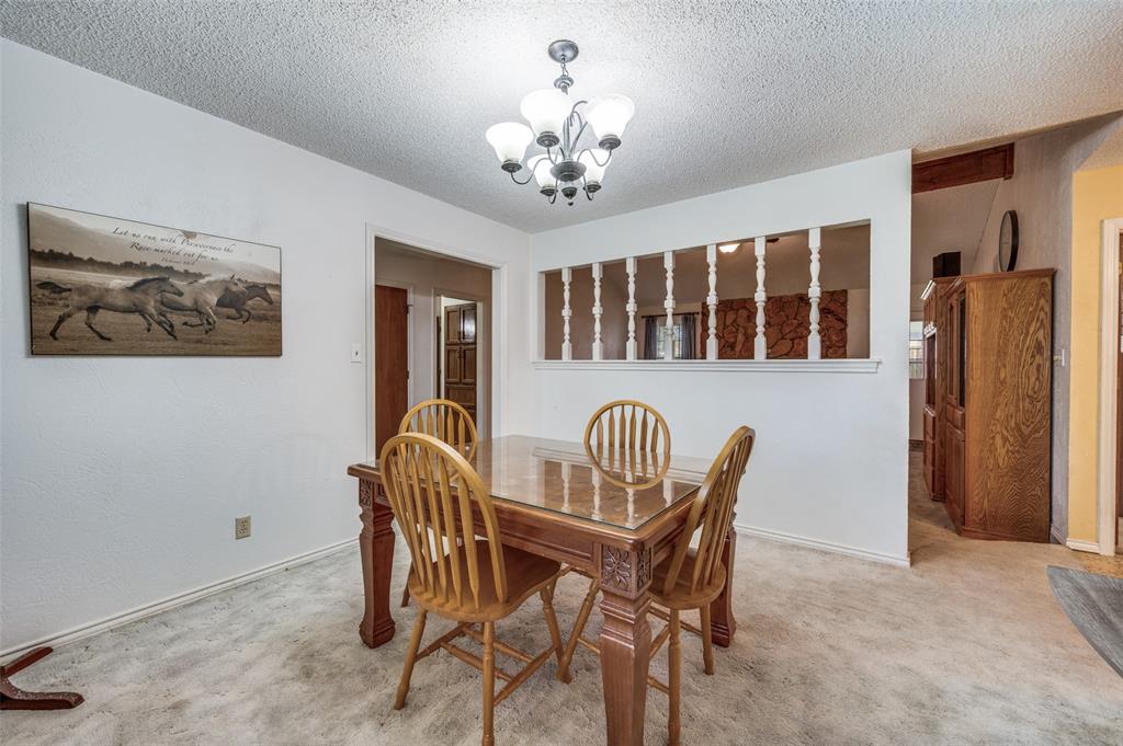 508 South Pedigo Street Pilot Point, TX 76258 - Photo 8 of 25 a dining room with furniture and chandelier