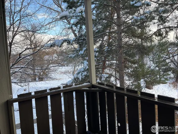 a wooden fence with a trees in the background