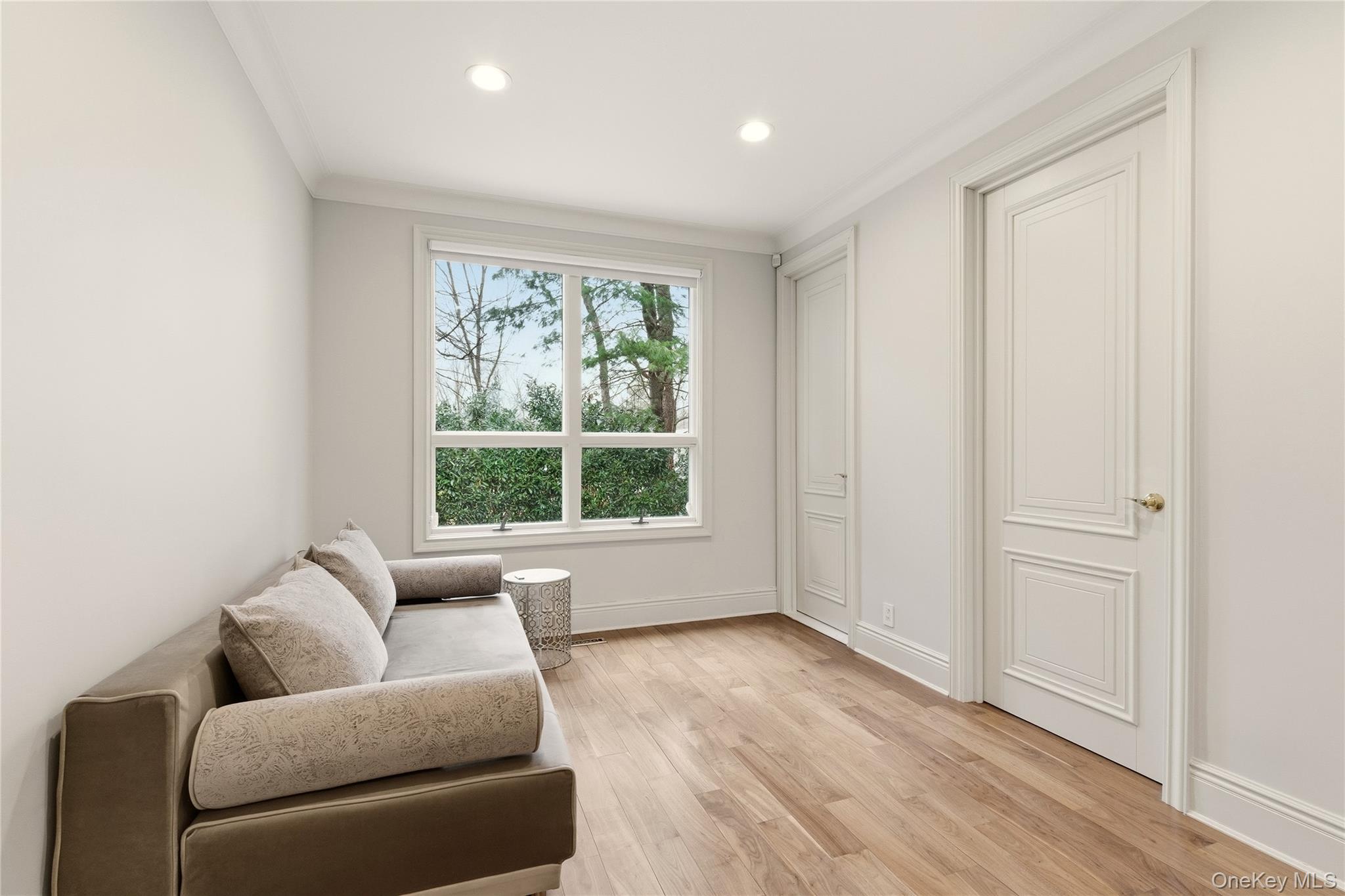 55 Coves Run Syosset, NY 11791 - Photo 35 of 50 a living room with furniture and a window