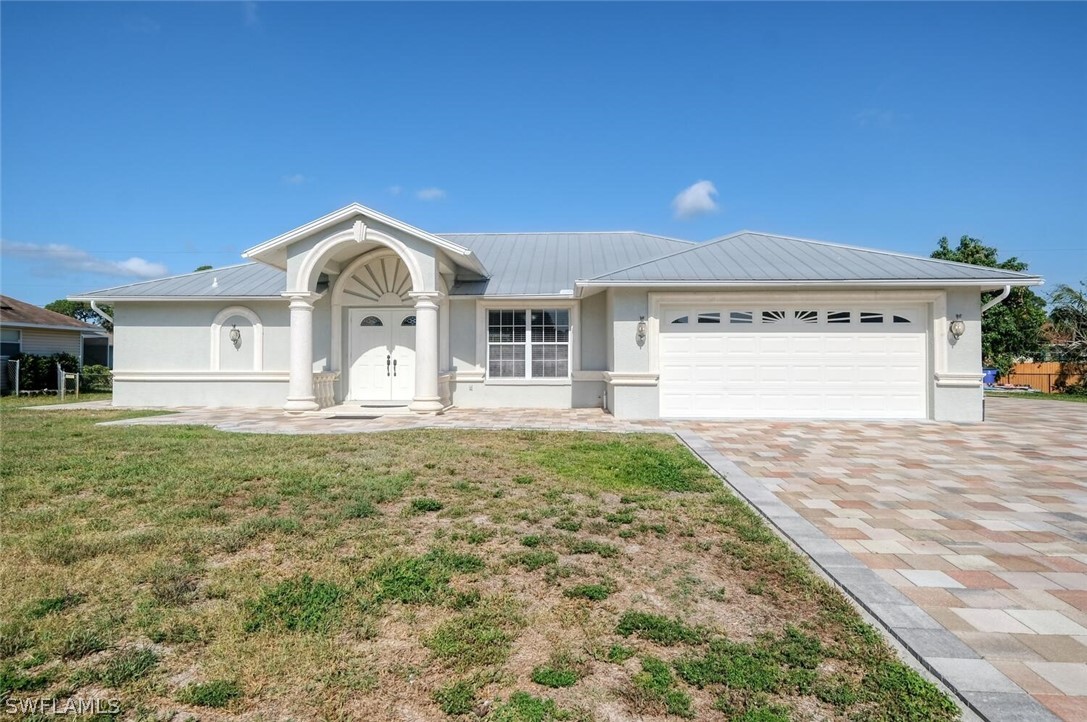 18246 Sycamore Road Fort Myers, FL 33967 - Photo 1 of 35 a front view of a house with a yard
