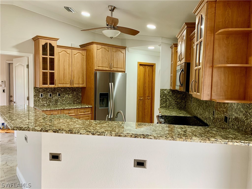 18246 Sycamore Road Fort Myers, FL 33967 - Photo 11 of 35 a bathroom with a granite countertop sink and a mirror