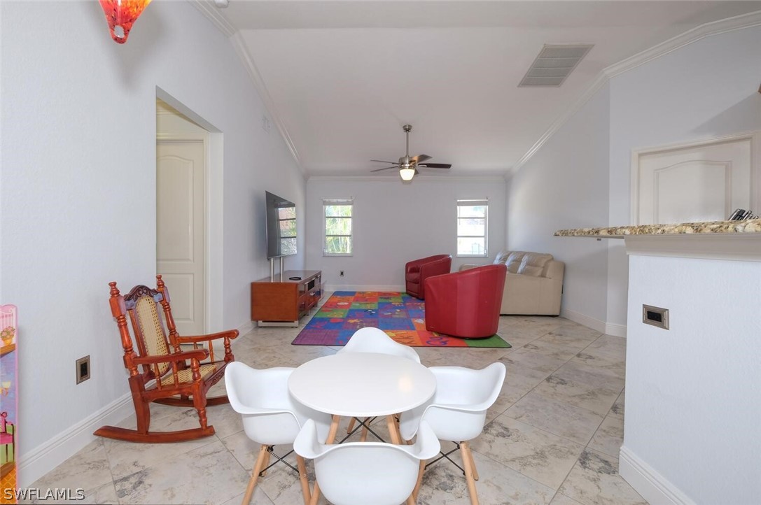 18246 Sycamore Road Fort Myers, FL 33967 - Photo 17 of 35 a living room with furniture a rug and white walls
