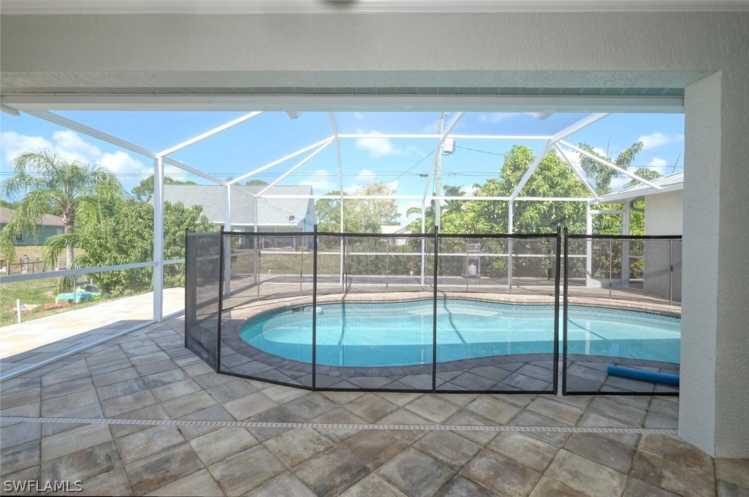 18246 Sycamore Road Fort Myers, FL 33967 - Photo 26 of 35 a view of a room with sliding glass door and mountain view