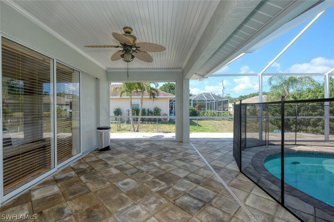 18246 Sycamore Road Fort Myers, FL 33967 - Photo 28 of 35 a view of a porch with furniture and wooden floor