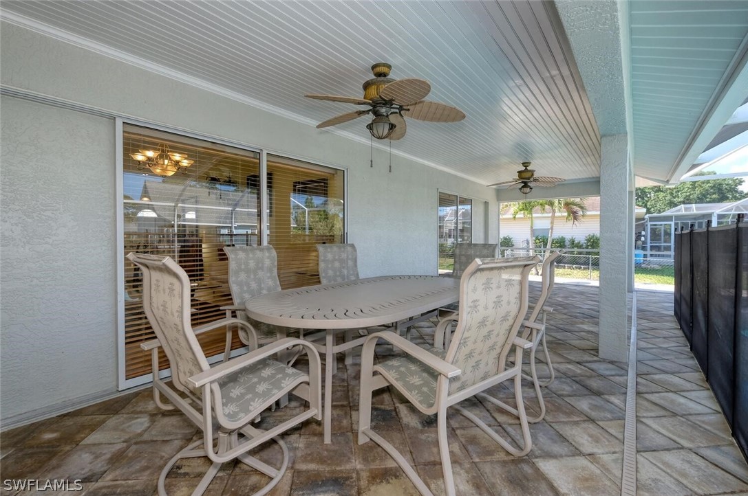 18246 Sycamore Road Fort Myers, FL 33967 - Photo 29 of 35 a view of a dining room with furniture wooden floor and chandelier