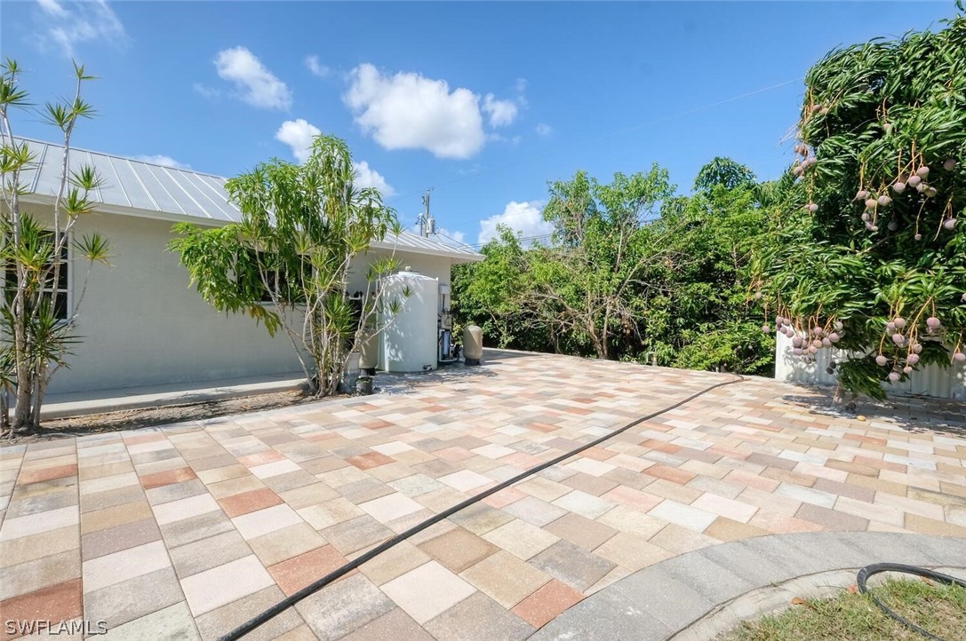 18246 Sycamore Road Fort Myers, FL 33967 - Photo 30 of 35 a view of a backyard of the house