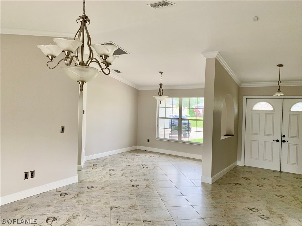 18246 Sycamore Road Fort Myers, FL 33967 - Photo 3 of 35 a view of a chandelier in a room