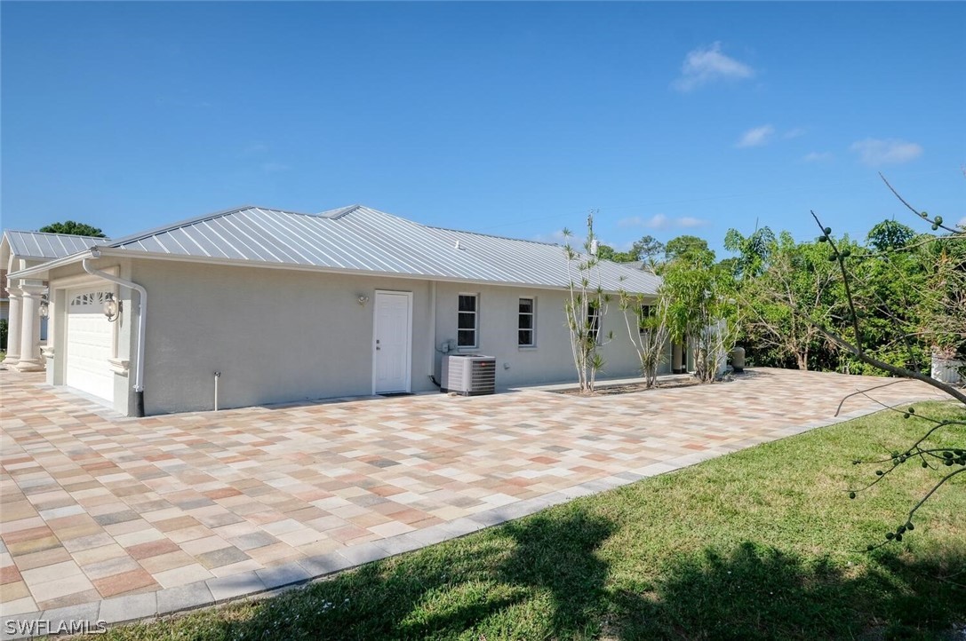 18246 Sycamore Road Fort Myers, FL 33967 - Photo 35 of 35 a front view of a house with a yard