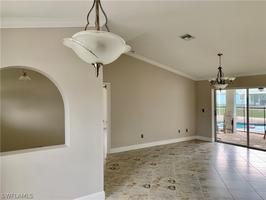18246 Sycamore Road Fort Myers, FL 33967 - Photo 4 of 35 a view of a room with wooden floor and windows