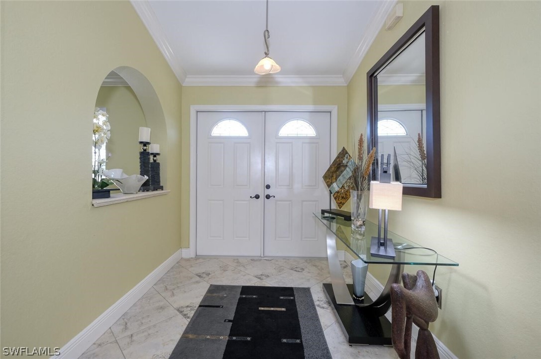 18246 Sycamore Road Fort Myers, FL 33967 - Photo 5 of 35 a view of hallway with furniture and a mirror