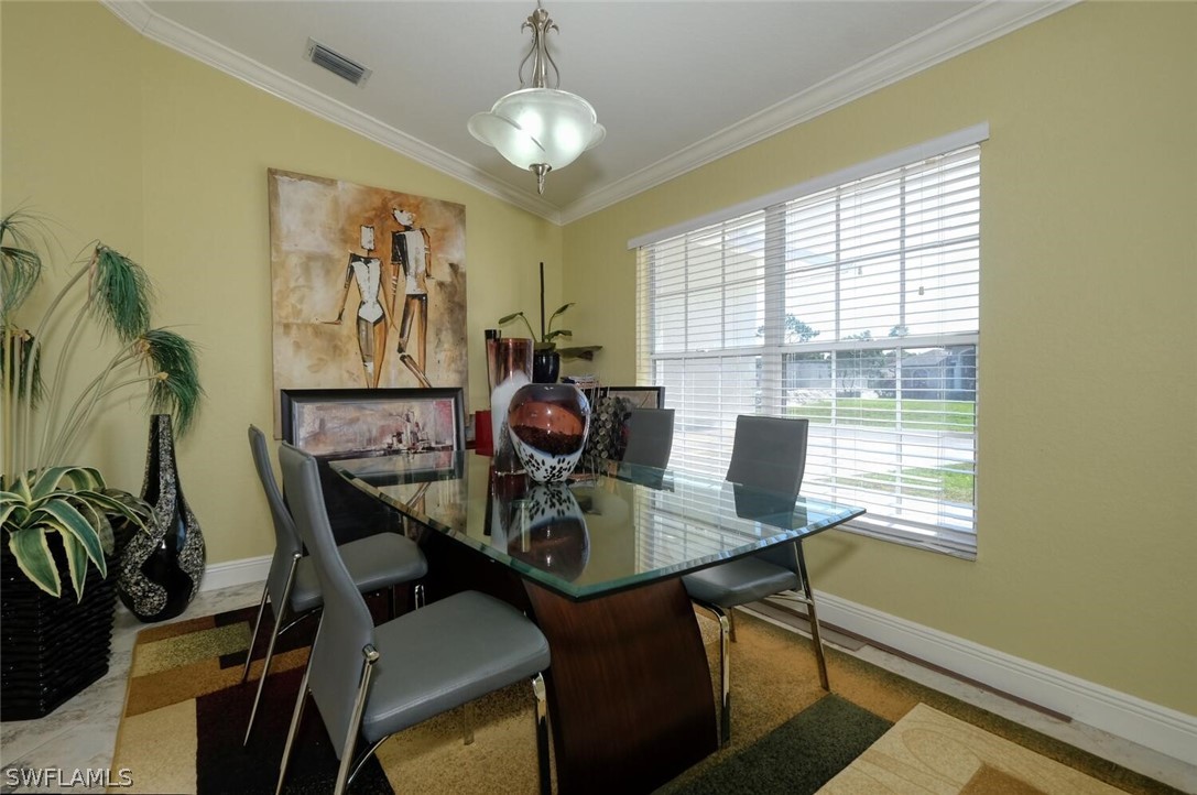 18246 Sycamore Road Fort Myers, FL 33967 - Photo 7 of 35 a view of a dining room with furniture window and outside view