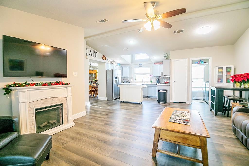 11661 Dane Road Pilot Point, TX 76258 - Photo 15 of 40 a living room with furniture and a fireplace