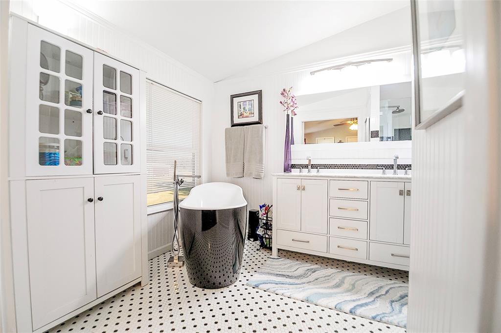 11661 Dane Road Pilot Point, TX 76258 - Photo 17 of 40 a room with a baby crib and dresser