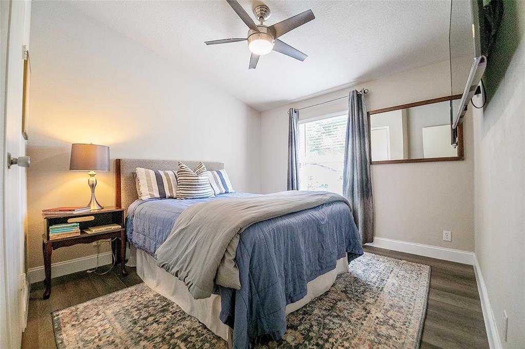 11661 Dane Road Pilot Point, TX 76258 - Photo 19 of 40 a bedroom with a bed and wooden floor