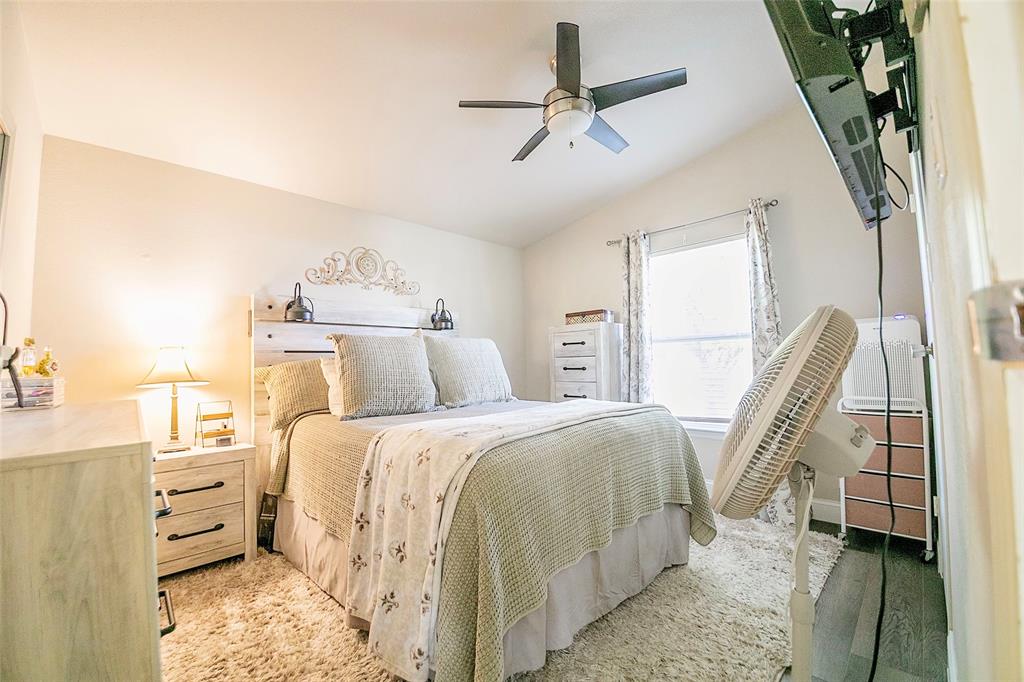 11661 Dane Road Pilot Point, TX 76258 - Photo 20 of 40 a bed room with a bed and a ceiling fan