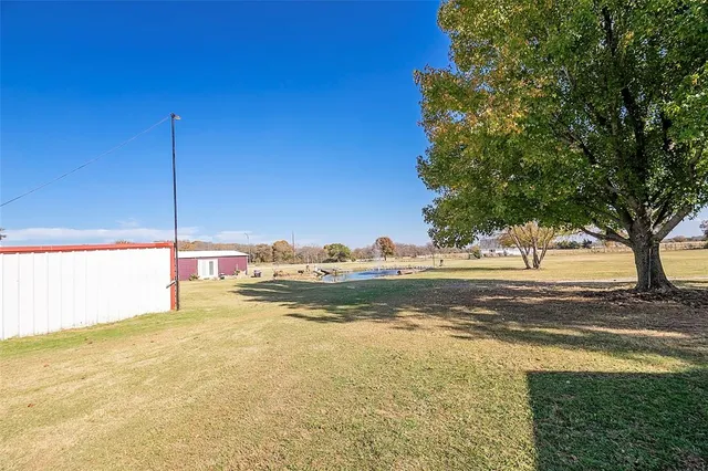 a view of a house with a big yard