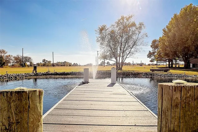 a view of a house with yard and sitting area