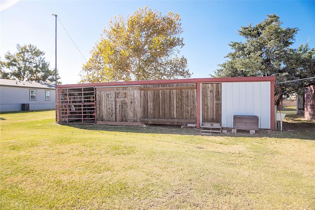 11661 Dane Road Pilot Point, TX 76258 - Photo 26 of 40 a view of a swimming pool with a yard