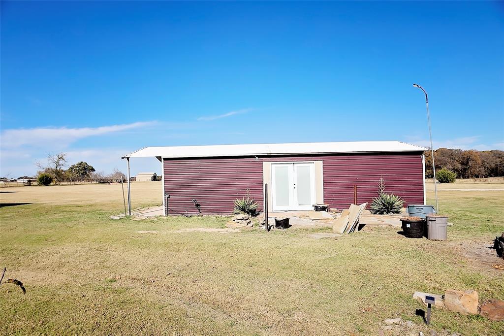 11661 Dane Road Pilot Point, TX 76258 - Photo 30 of 40 a row of table and chairs on the side of the ocean