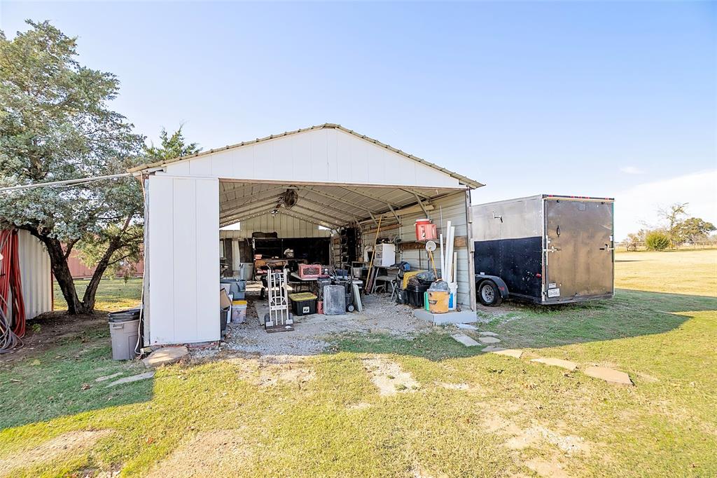 11661 Dane Road Pilot Point, TX 76258 - Photo 33 of 40 a view of a house with a yard and sitting area