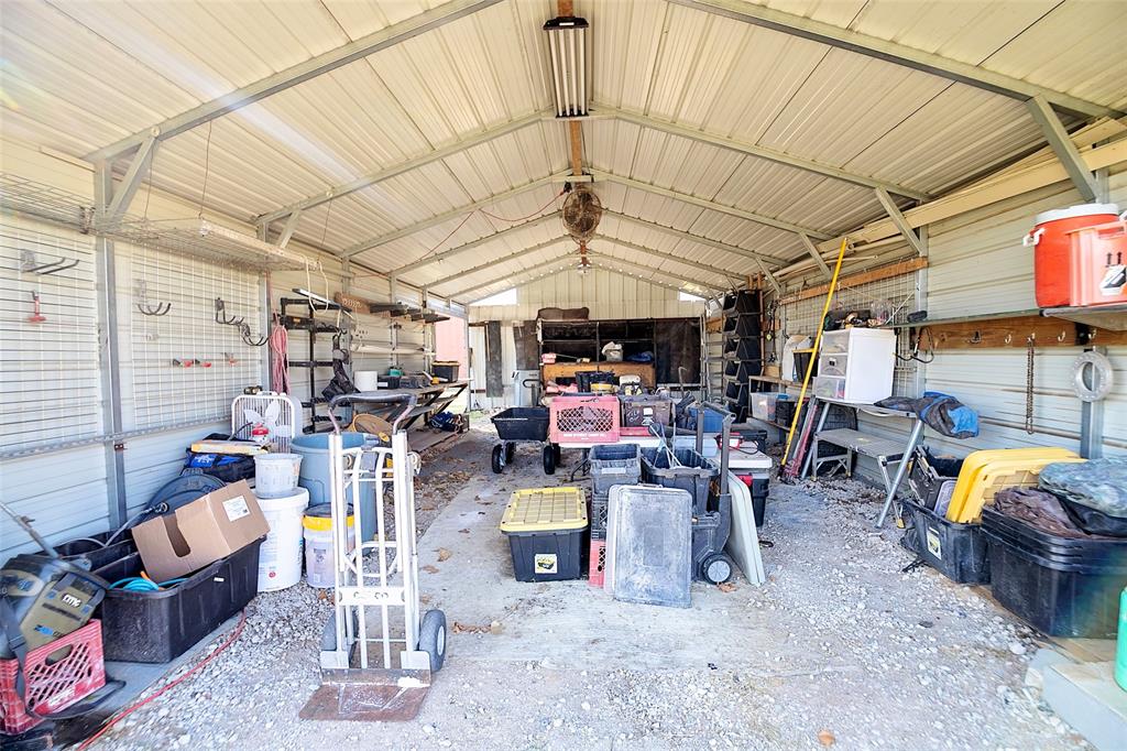 11661 Dane Road Pilot Point, TX 76258 - Photo 34 of 40 a view of a storage room with racks
