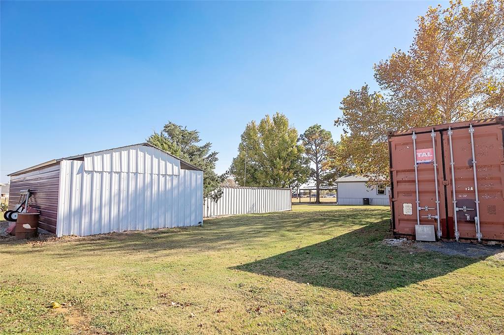 11661 Dane Road Pilot Point, TX 76258 - Photo 39 of 40 a view of a backyard with swimming pool