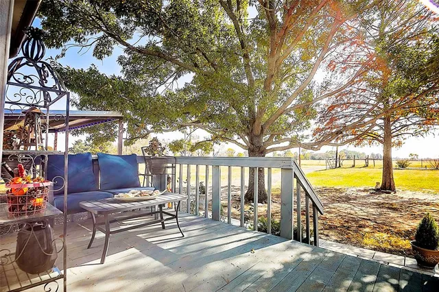 a view of swimming pool with lounge chairs