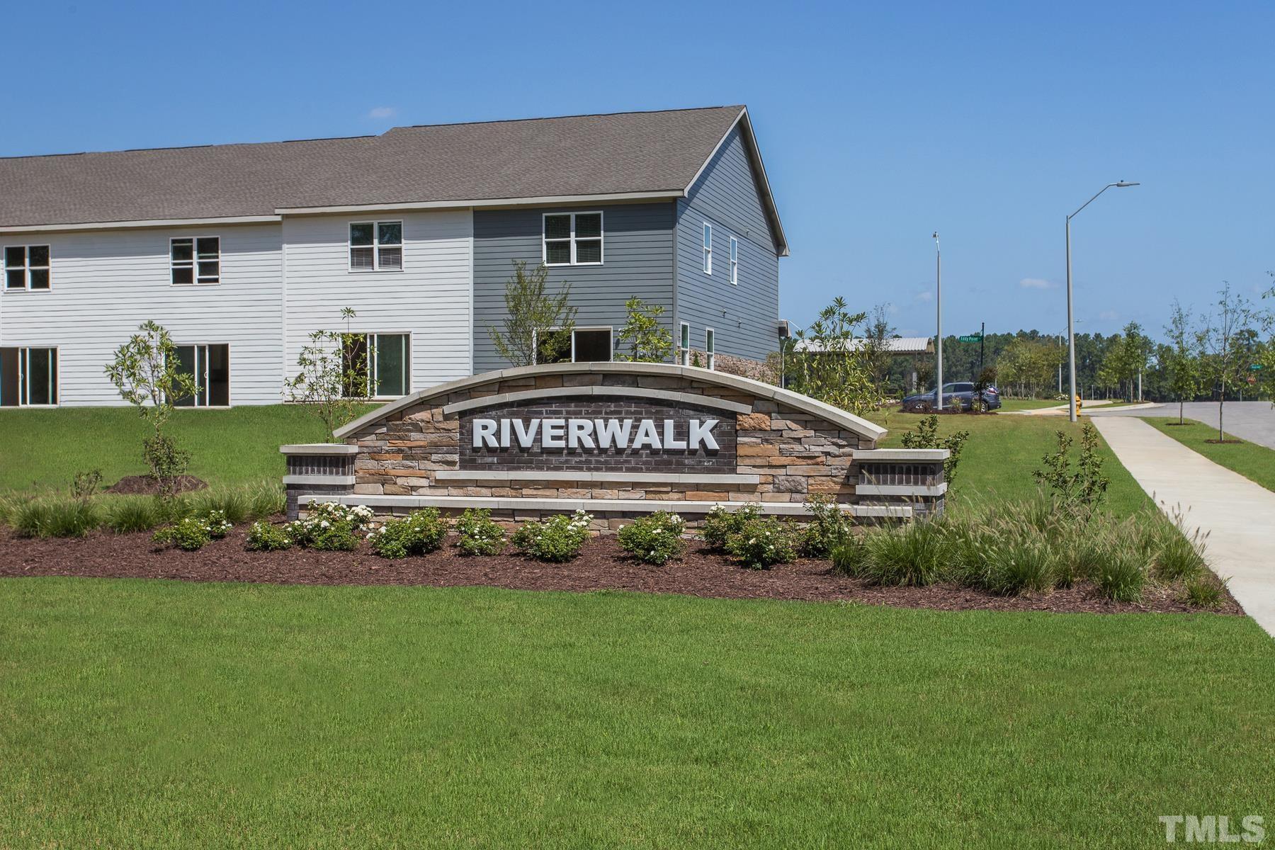 6936 Outfall Point Lane Raleigh, NC 27616 - Photo 4 of 9 a view of a house with a yard