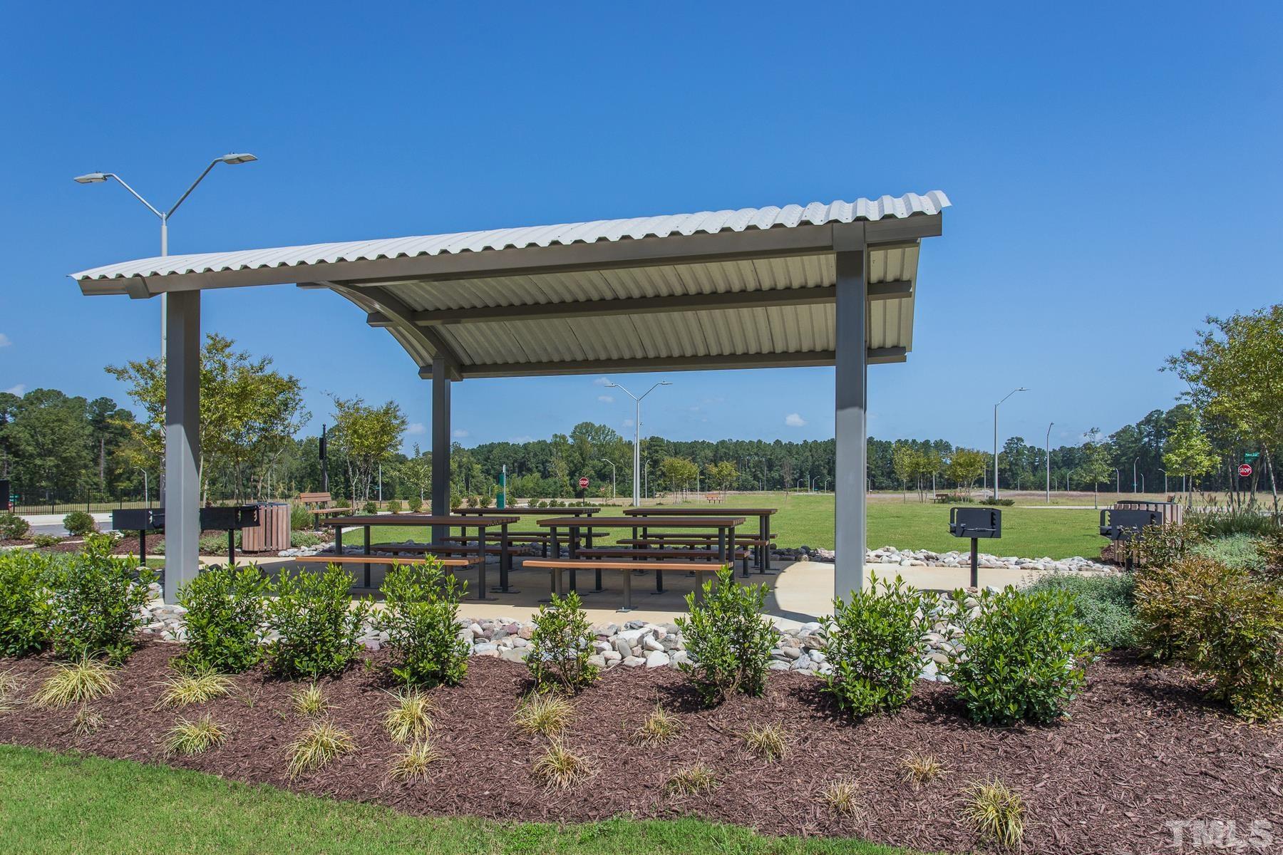 6936 Outfall Point Lane Raleigh, NC 27616 - Photo 5 of 9 a view of a house with a big yard