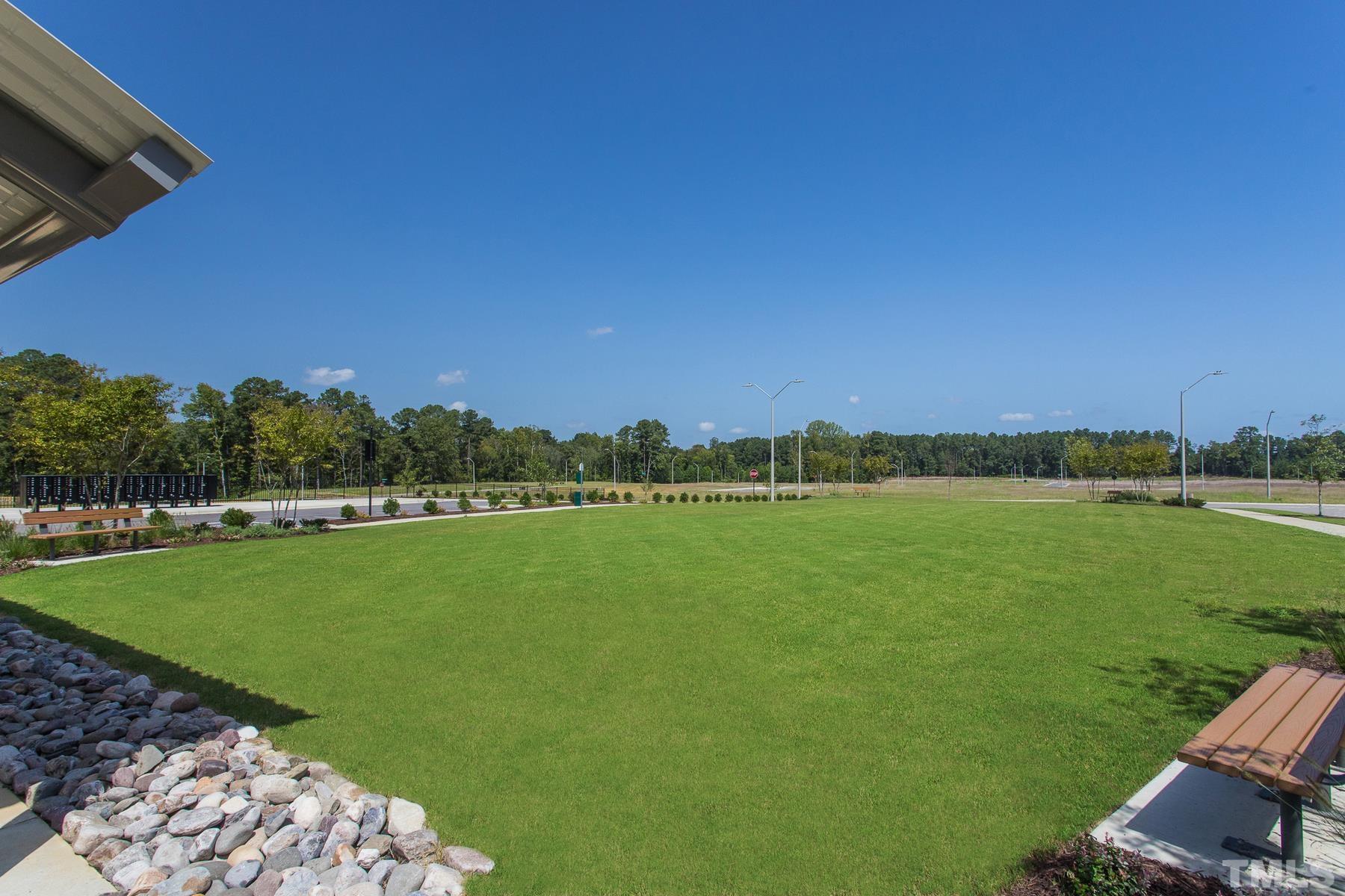 6936 Outfall Point Lane Raleigh, NC 27616 - Photo 9 of 9 a view of a lake with a big yard